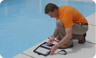 pool cleaning kit being used