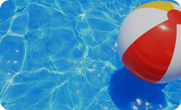 beach ball floating in pool